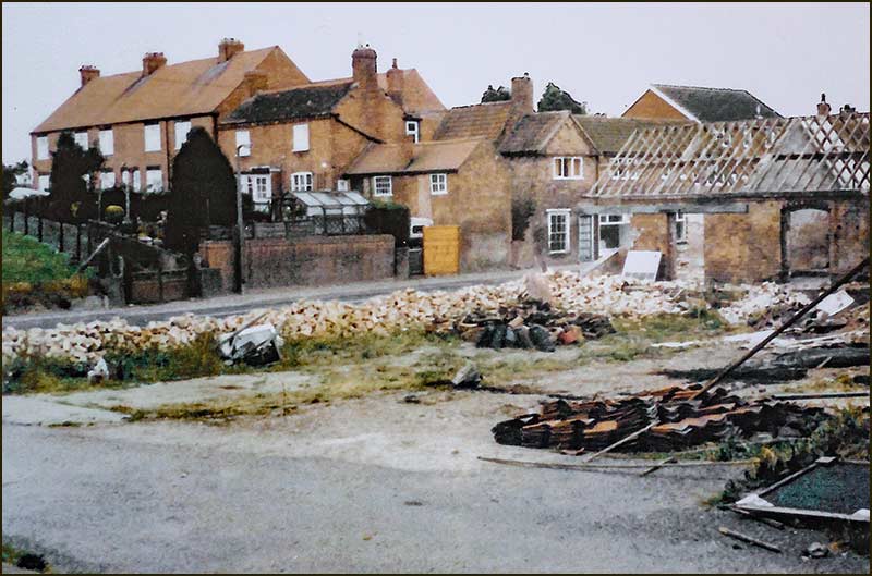 'The Yews' farm buildings being demolished in 1983